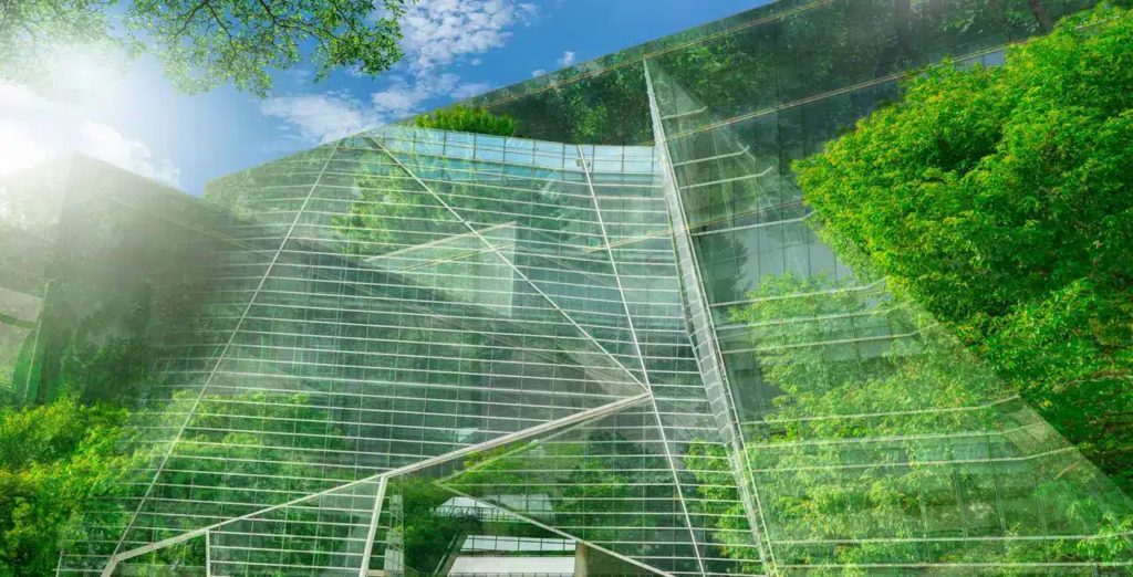 A glass building with trees in the background

Description automatically generated