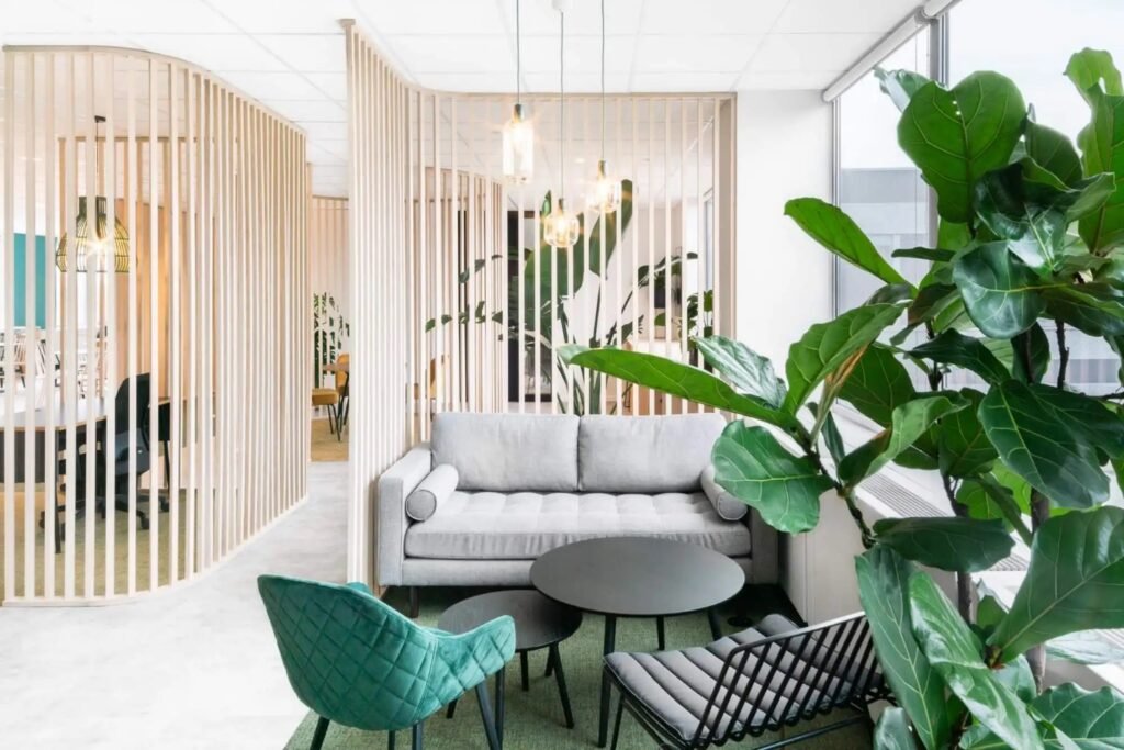 A room with a couch and chairs

AI-generated content may be incorrect.